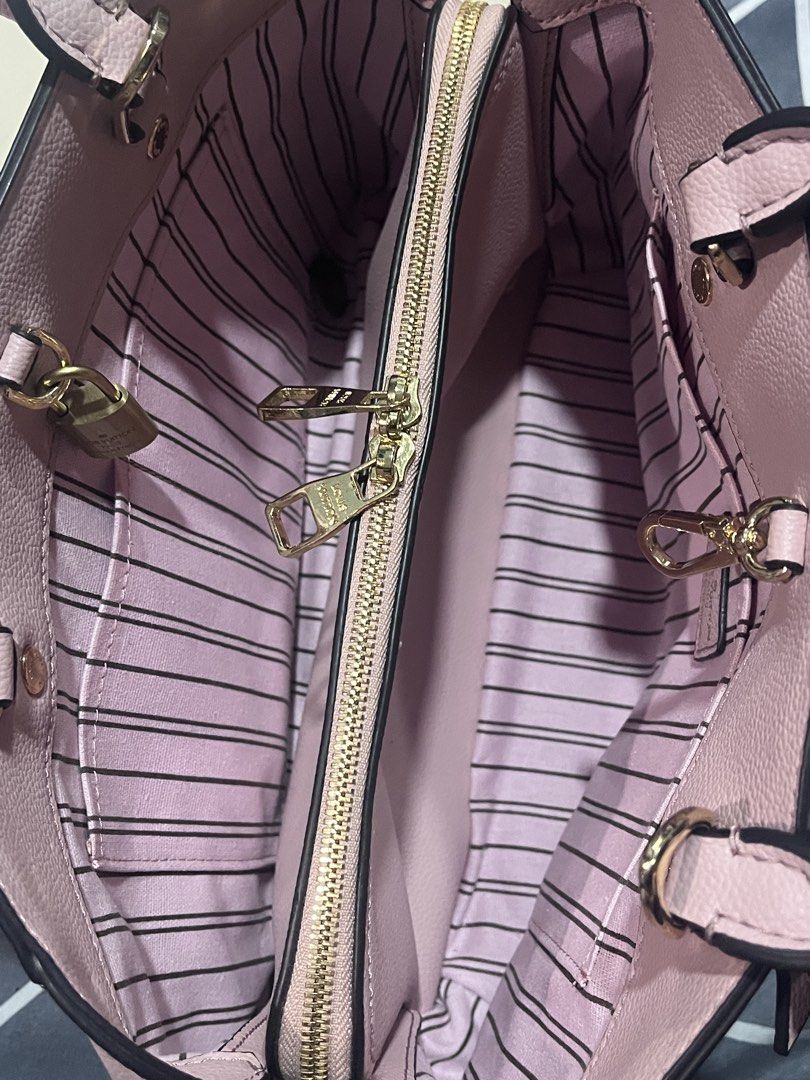 LV Pink Perforated Handbag (Category: Luxury Bags & Wallets) located in Bulacan. Submitted by owiepot (Listing ID 1427895443, Image 3). Description: Authentic LV handbag in a soft pink color. Features a perforated monogram design, top handles, and a detachable shoulder strap. The interior has a striped lining and a zippered compartment. Includes a dust bag. Made in France..