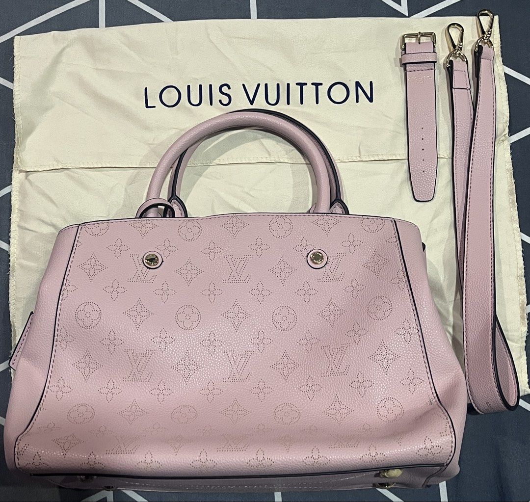 LV Pink Perforated Handbag (Category: Luxury Bags & Wallets) located in Bulacan. Submitted by owiepot (Listing ID 1427895443, Image 2). Description: Authentic LV handbag in a soft pink color. Features a perforated monogram design, top handles, and a detachable shoulder strap. The interior has a striped lining and a zippered compartment. Includes a dust bag. Made in France..