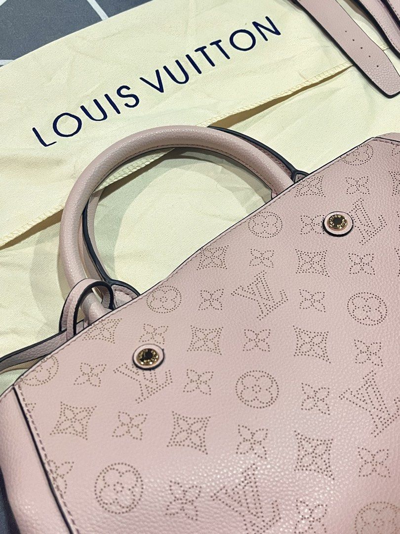 LV Pink Perforated Handbag (Category: Luxury Bags & Wallets) located in Bulacan. Submitted by owiepot (Listing ID 1427895443, Image 1). Description: Authentic LV handbag in a soft pink color. Features a perforated monogram design, top handles, and a detachable shoulder strap. The interior has a striped lining and a zippered compartment. Includes a dust bag. Made in France..