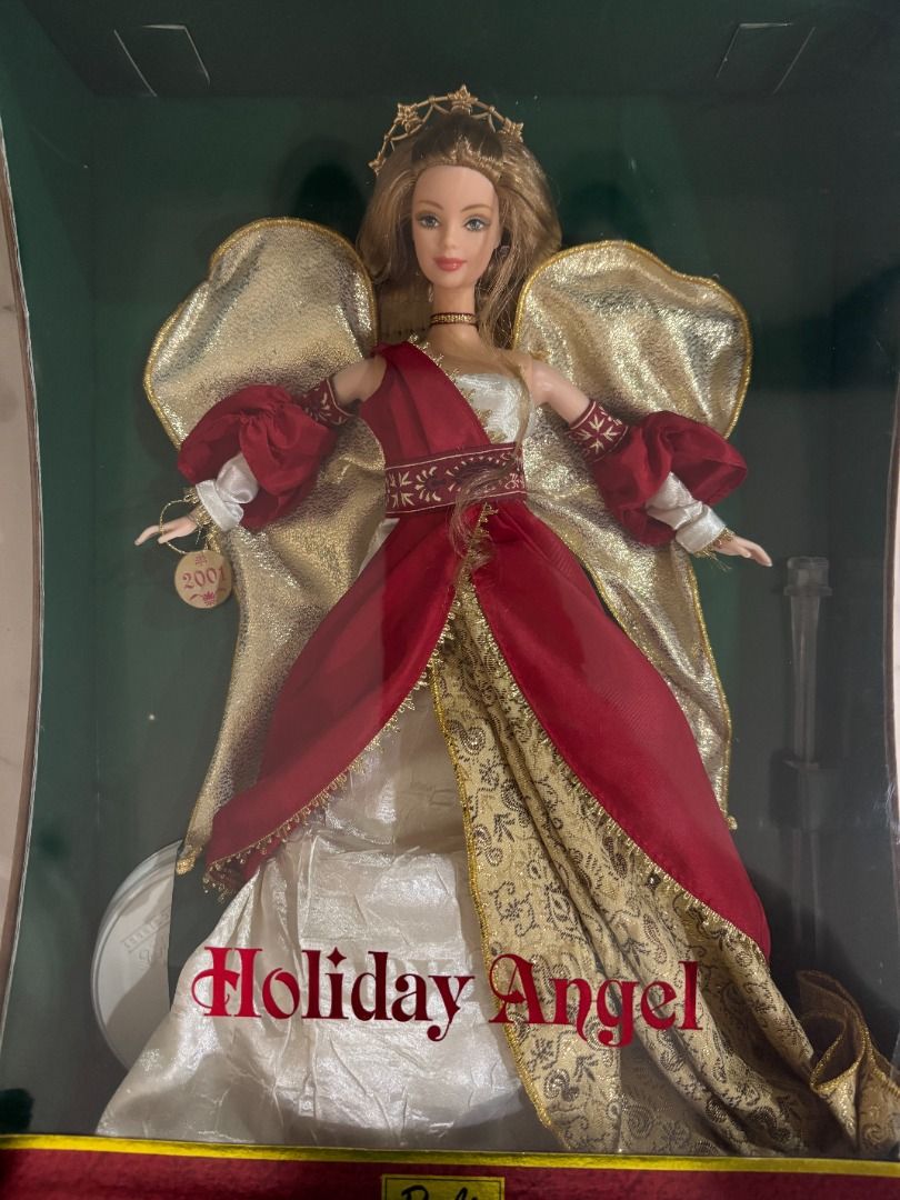 Mattel Barbie Angels Collectors' (Category: Figurines & Statues) located in Makati City. Submitted by gabdee (Listing ID 1427824656, Image 1). Description: Mattel Barbie - Holiday Angel Doll - Collector Edition 2000 Mattel Red Mint in box = 6000 Blue Mint in box = 6000 Golden Angel Barbie (Pink label) Mint in Box = 6000 1998 - Mattel - Barbie Collectibles - Angel of Joy Barbie - 1st in Series - Timeless Sentiments Collection - Collector Edition =
