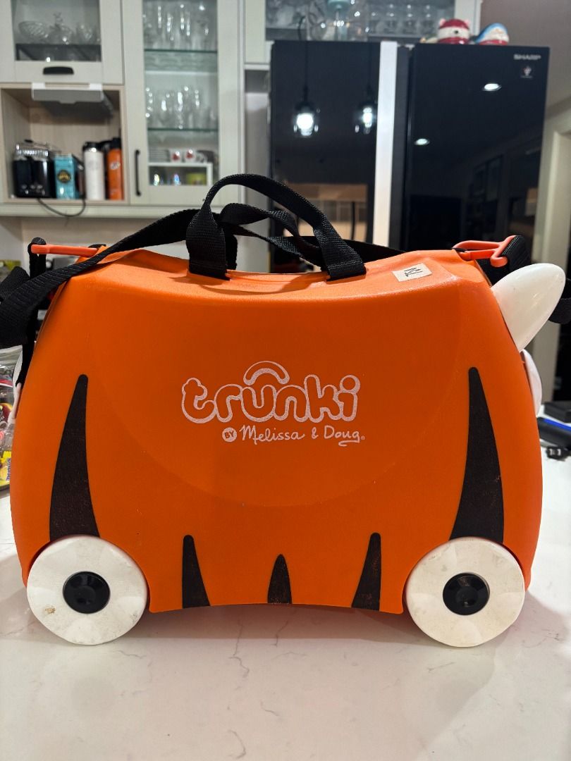 Repriced: Melissa & Doug's Trunki Original (Category: Babies & Kids Fashion) located in Makati City. Submitted by gabdee (Listing ID 1427826378, Image 1). Description: Repriced from 1200 Found out the removable inside straps and small pocket is not in there Kids Ride-On Suitcase and Carry-On Luggage For Kids Tiger Design Travel & Ride-on Used marks on wheels but body and inside like new.