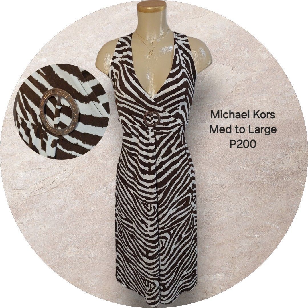 Michael Kors Zebra Print Dress (Category: Dresses) located in Binan City. Submitted by cp_ph (Listing ID 1427824451, Image 1). Description: Stylish Michael Kors dress featuring a striking zebra print. It has a V-neckline and a decorative buckle at the waist. A perfect addition to your wardrobe for a chic and fashionable look..