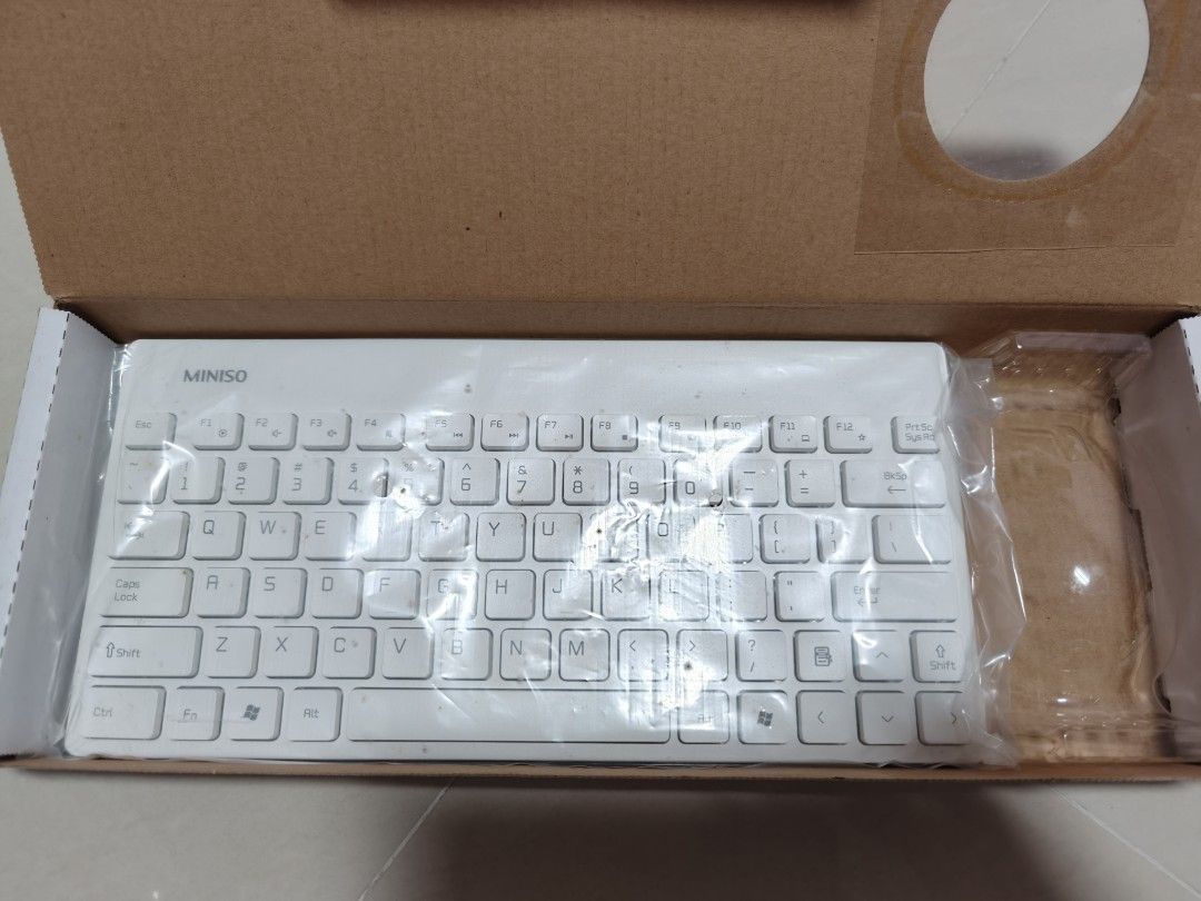 Miniso Wireless Keyboard (Category: Computer Keyboard) located in Singapore. Submitted by euniece2090300 (Listing ID 1427921052, Image 2). Description: - Not for fussy. - Brand new Miniso wireless keyboard. Took and used the mouse but didn't use the keyboard. - selling keyboard only. - kept in cupboard for quite long, so the box and the keyboard are mouldy. Will sell as it is. - Selling for S$4. - Cash transaction Only. - Meet up at Marsiling. Po