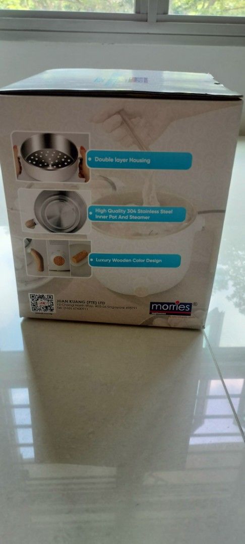 Mommes Multi-Function Induction Cooker (Category: Cookers) located in Singapore. Submitted by happydealzalways (Listing ID 1427799072, Image 2). Description: Brand new Morries multi-function induction cooker. Features a 1.5L capacity, double-layer housing, and a high-quality 304 stainless steel inner pot and steamer. It has a stylish wooden-color design. Perfect for various cooking needs..