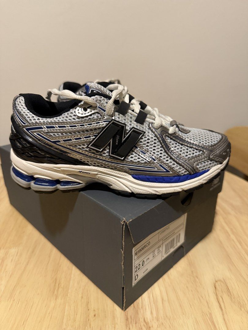New Balance M1906RCD Sneakers (Category: Sneakers) located in Taguig. Submitted by decmnl (Listing ID 1427880832, Image 3). Description: New Balance M1906RCD sneakers. Features a gray mesh upper with silver and blue accents. The shoes have a blue midsole and a black outsole. Comes with the original box. Size 22.0.Bought from Pasabuy Japan at aroun Php6,000 and used for 3x only..