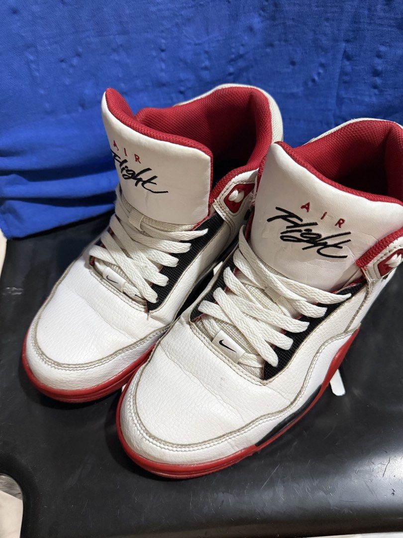 Nike Air Flight Sneakers - US 8 (Category: Sneakers) located in Quezon City. Submitted by piatot (Listing ID 1427784966, Image 2). Description: Nike Air Flight sneakers in white and red. Features the Air Flight logo on the tongue. The size is US 8, UK 7, EUR 41, and CM 26.0. Made in Indonesia. The soles are red and black with the Nike logo. The shoes have white laces and a red interior. .