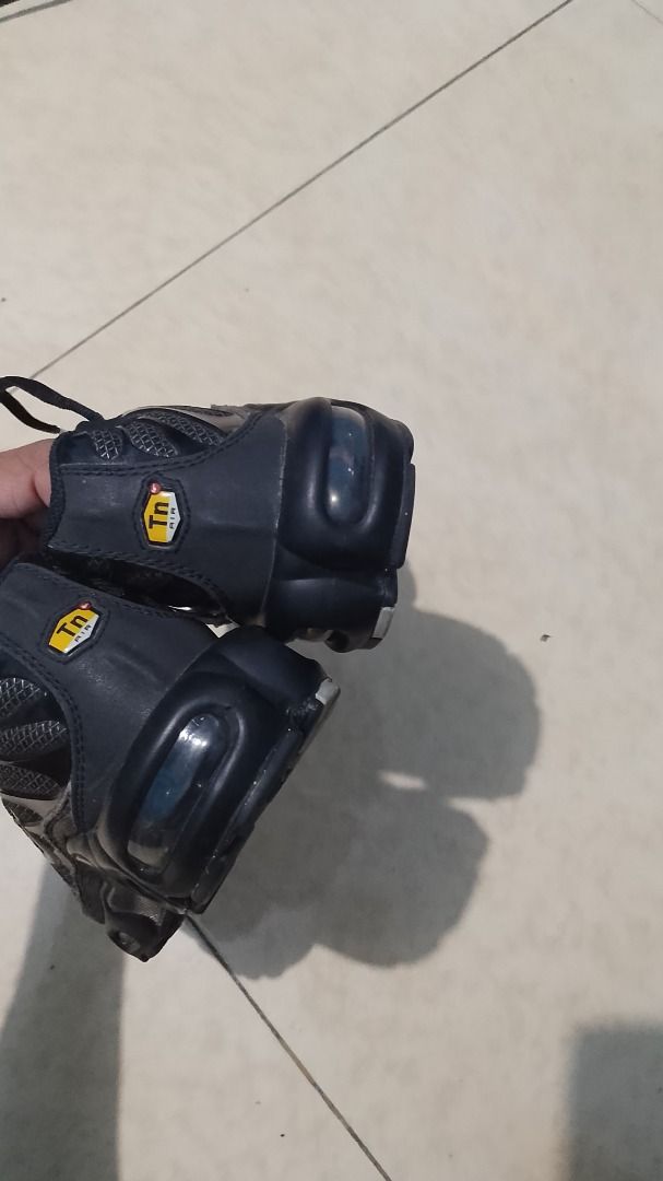 Nike Air Max Plus TN Metalic Black (Category: Sneakers) located in Pateros City. Submitted by blvd_store (Listing ID 1427787215, Image 2). Description: Nike Air Max Plus TN in black. Features a black mesh upper with signature TPU overlays. The shoe has a visible Air Max unit in the heel and a rubber outsole for traction. The size is UK 3, EUR 36, and US 5.5. Made in Indonesia..