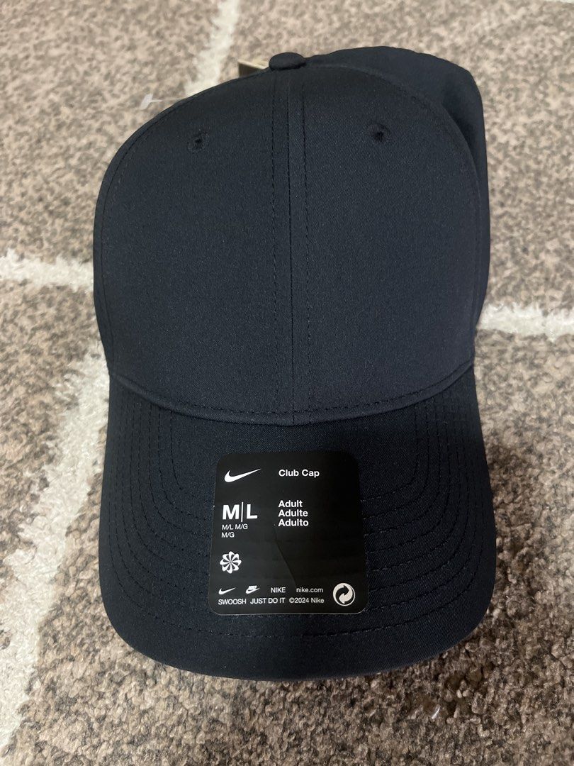 Nike Club Cap M/L (Category: Caps & Hats) located in Pasig City. Submitted by jundbaptist21 (Listing ID 1427823473, Image 1). Description: Nike Club Cap in size M/L. It is black and has the Nike logo on the front and back. The cap has an adjustable strap at the back. The original tag is still attached, showing a suggested retail price of $24. Original from u.s.