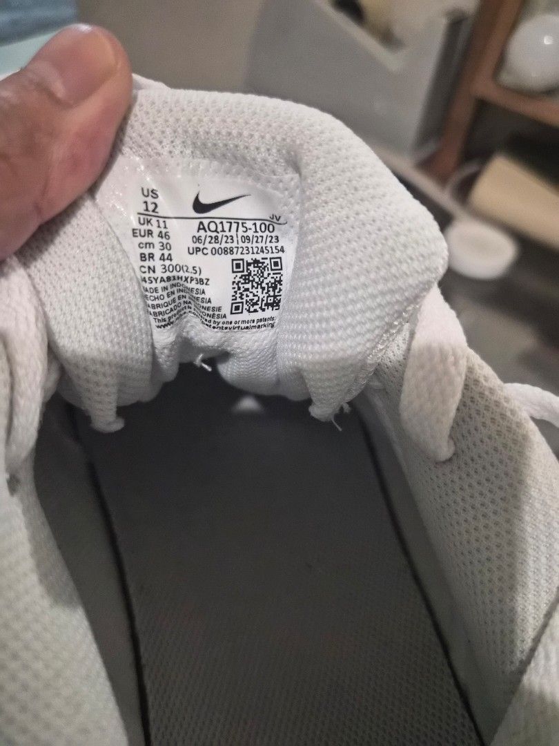 Nike Men's Ebernon Low Shoes - Triple White (Category: Sneakers) located in Pasay City. Submitted by frannymae1211 (Listing ID 1427906232, Image 3). Description: White Nike Ebernon Low shoes. The shoes are size US 12, EUR 46, and CM 30. The style code is AQ1775-100. The shoes have a white sole and a white Nike swoosh logo on the side. Brand new and authentic but no box. Received as a gift. Rfs, Decluttering .