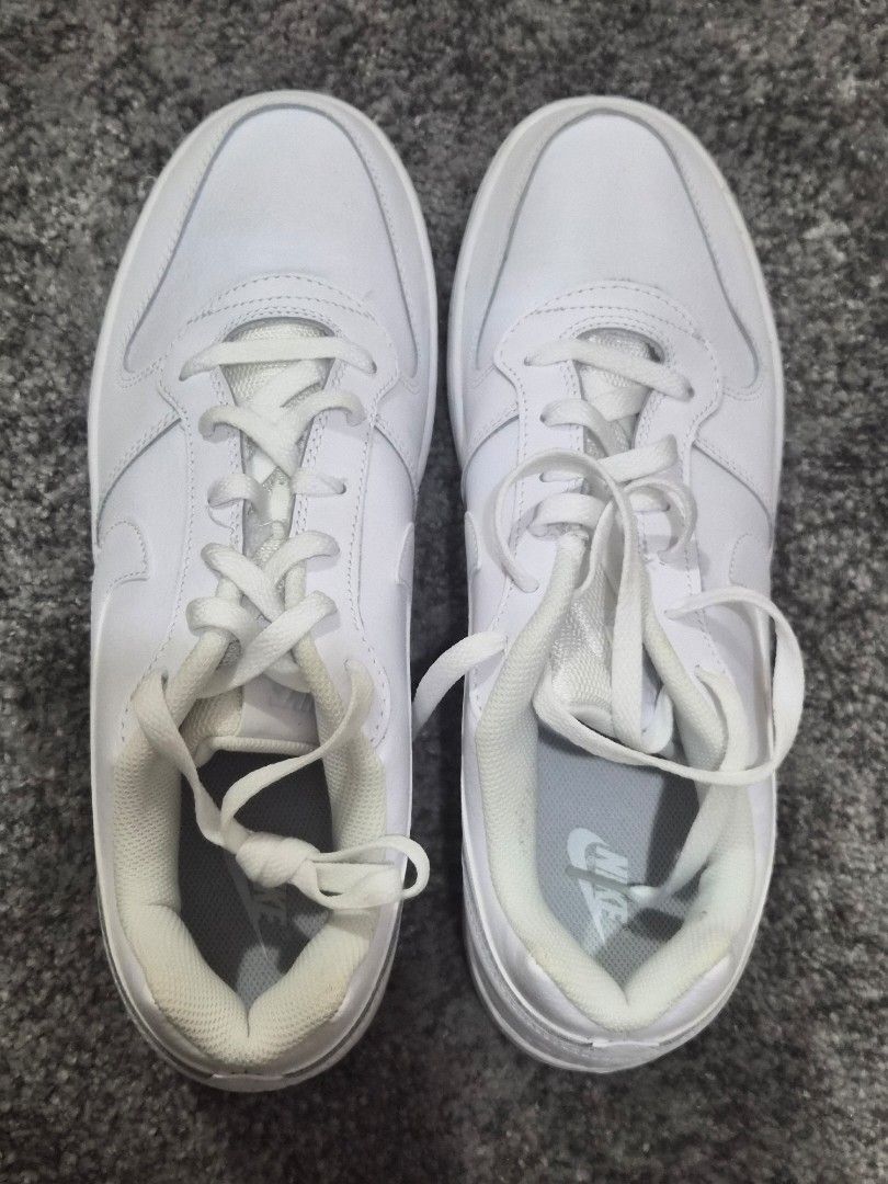 Nike Men's Ebernon Low Shoes - Triple White (Category: Sneakers) located in Pasay City. Submitted by frannymae1211 (Listing ID 1427906232, Image 2). Description: White Nike Ebernon Low shoes. The shoes are size US 12, EUR 46, and CM 30. The style code is AQ1775-100. The shoes have a white sole and a white Nike swoosh logo on the side. Brand new and authentic but no box. Received as a gift. Rfs, Decluttering .