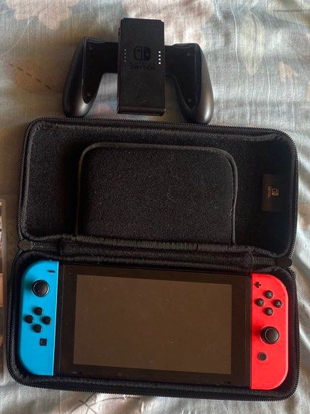 Nintendo Switch with Case, Controller (Category: Nintendo) located in Pasig City. Submitted by ziggymolit (Listing ID 1427851557, Image 1). Description: Comes with: Switch Travel protective case Controller for joy cons Flaws: Minor stick drift Scratches Loc cainta Msg for more details .