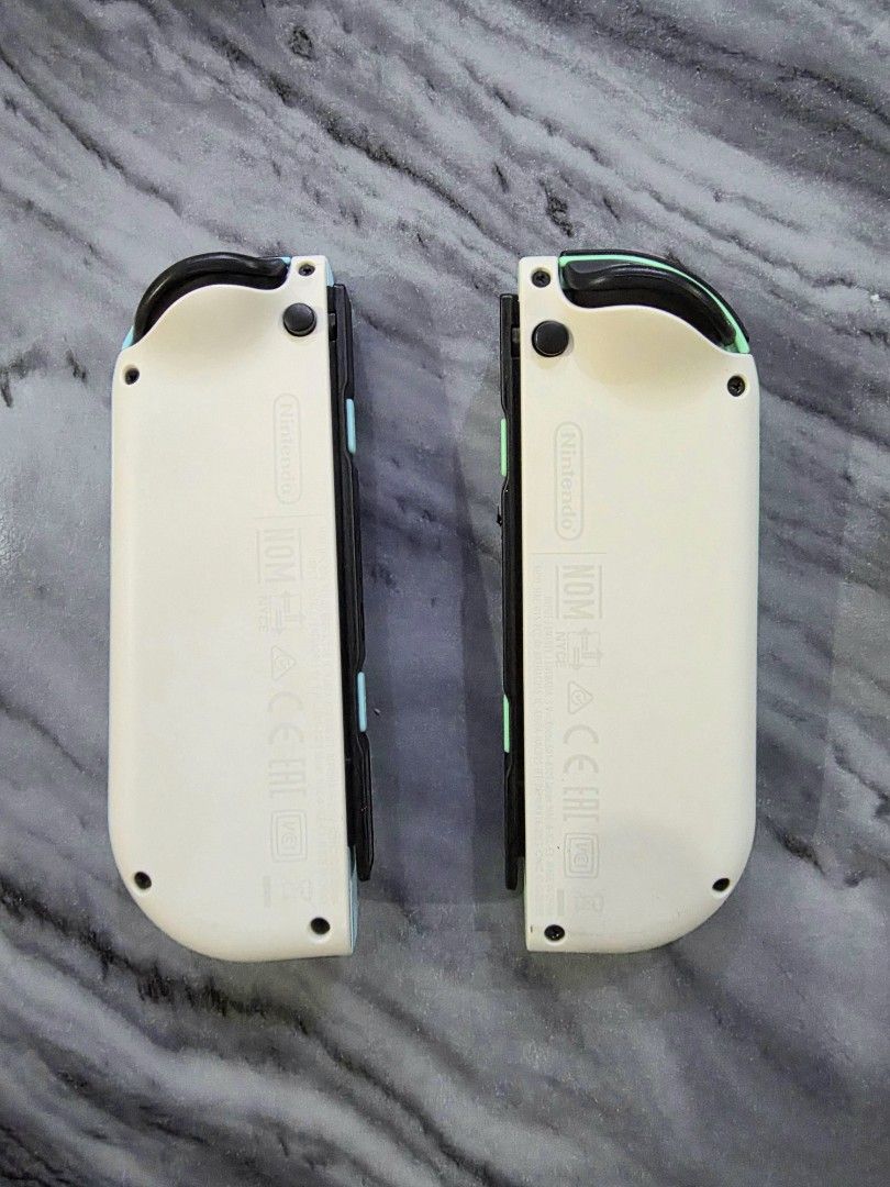Nintendo Switch Joy Cons Animal Crossing Edition (Authentic) (Category: Controllers) located in Mandaluyong City. Submitted by chan.ningtatum (Listing ID 1427821545, Image 2). Description: For sale! Animal Crossing Left and Right Joycons These Joycons came from the Animal Crossing Nintendo Switch Version Good Working Condition. No Issue. Original / Authentic joycons. Checkouts via Shope e and Laz ada Available Shipping: Lalamove, Grab Meet ups: M