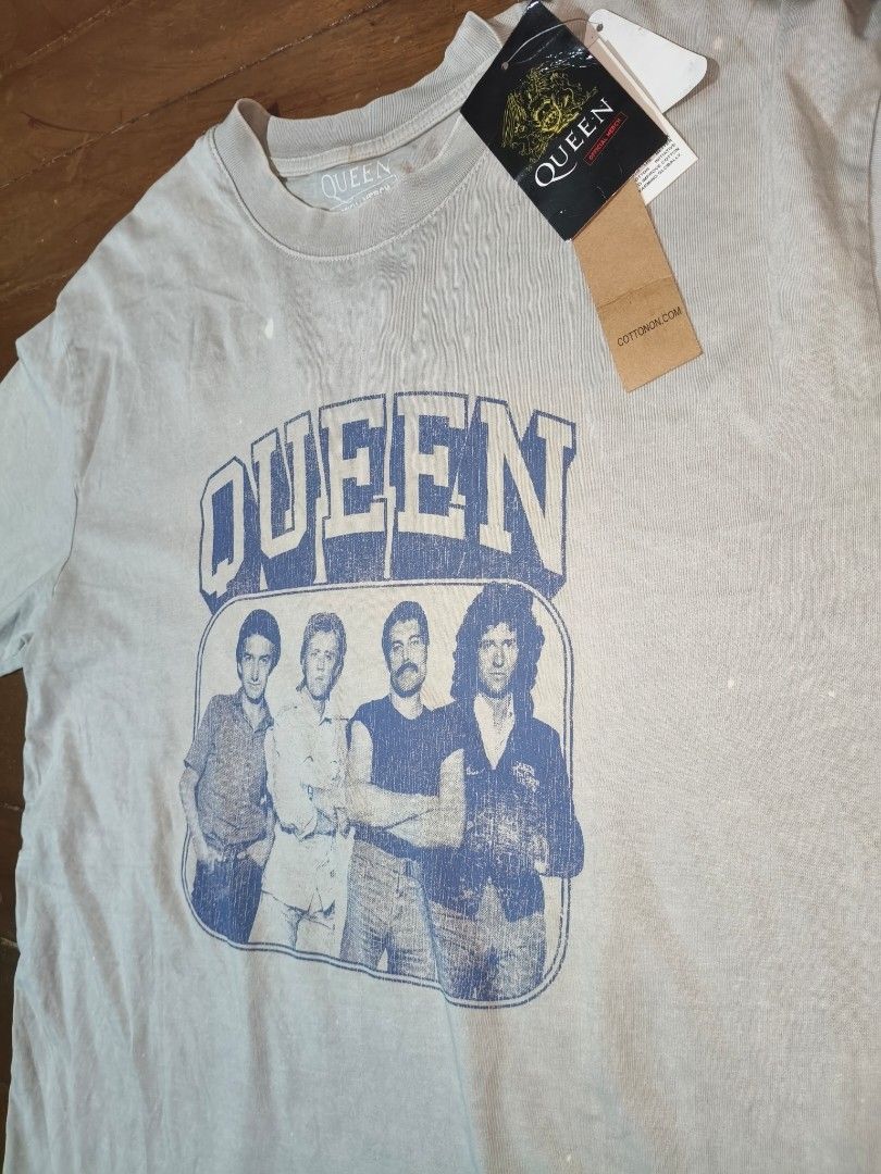 Official Queen merch (2025, Cotton On) (Category: Tshirts & Polo Shirts ) located in Marikina City. Submitted by jamvg (Listing ID 1427797112, Image 2). Description: MISPRINTS: 1. Shirt says size M, but when fitted is size XL 2. The "L" in "OFFICIAL MERCH" is off centered (misprint) ^^This is a factory defect—also has subtle bleach marks seen in photos. Includes the original tags willing to negotiate price 👍🏿.