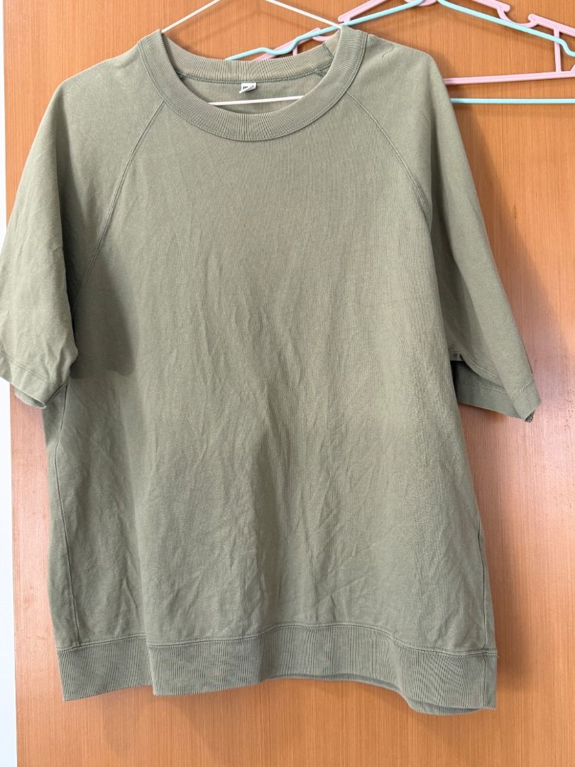 Olive Green Short Sleeve Sweatshirt (Category: Tshirts & Polo Shirts ) located in Makati City. Submitted by dundermiff73421 (Listing ID 1427873443, Image 1). Description: Olive green short sleeve sweatshirt. Features a crew neck and ribbed hem. The sleeves are raglan style. The fabric has a textured appearance. A simple and versatile top for everyday wear..