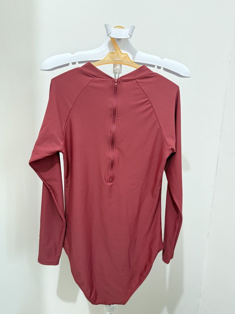 One-piece pink rash guard (Category: Rash guard) located in Taguig. Submitted by sofya07 (Listing ID 1427834059, Image 2). Description: Bench lovi poe collection No pads.