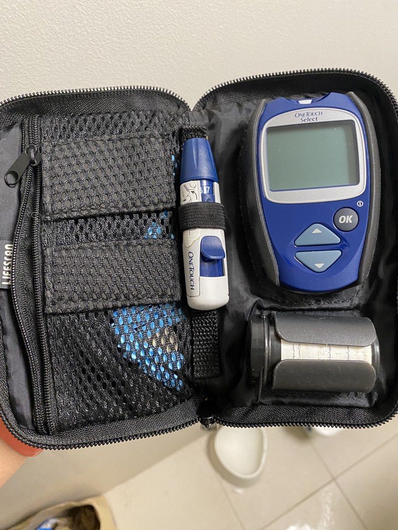 OneTouch Select Blood Glucose Meter Kit (Category: Medical Supplies & Tools) located in Makati City. Submitted by rye16 (Listing ID 1427809767, Image 1). Description: OneTouch Select blood glucose meter kit includes the meter, a lancing device, and a test strip container. It comes in a black carrying case with multiple compartments for organization. The meter has a blue and black design with an OK button. The lancing device is white and blue. The