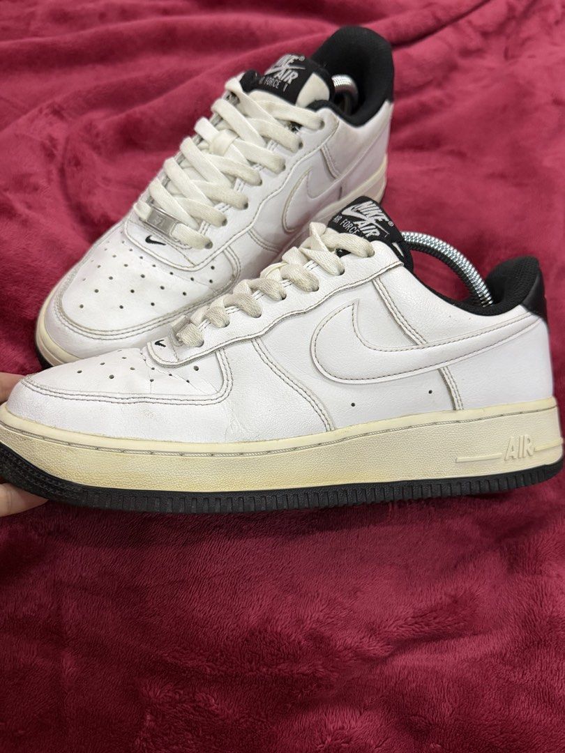 Original Nike Air Force 1 Low White Black (Category: Sneakers) located in Manila. Submitted by branded_preloved14 (Listing ID 1427913269, Image 1). Description: Classic Nike Air Force 1 Low in white and black. Features the iconic Nike swoosh on the sides. The shoes have a white leather upper with a black accent on the heel and tongue. The soles are off-white with a black outsole. Size 7 US. Includes shoe trees. No box. Needs wash. .