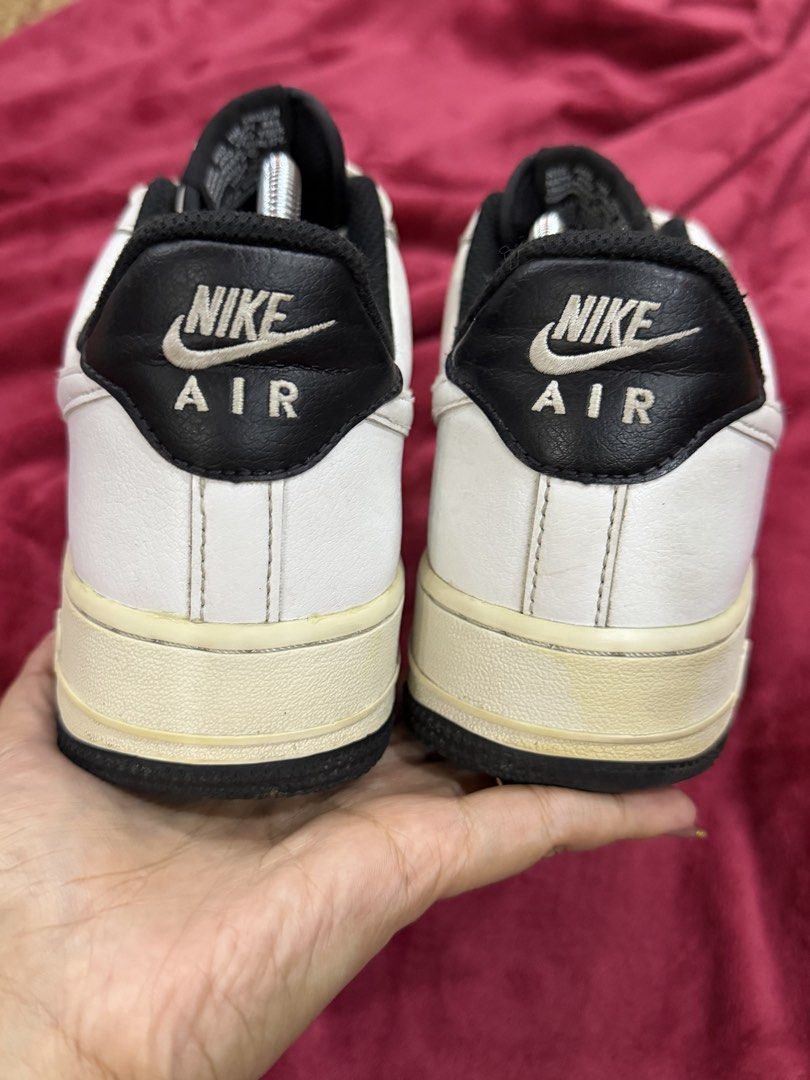Original Nike Air Force 1 Low White Black (Category: Sneakers) located in Manila. Submitted by branded_preloved14 (Listing ID 1427913269, Image 3). Description: Classic Nike Air Force 1 Low in white and black. Features the iconic Nike swoosh on the sides. The shoes have a white leather upper with a black accent on the heel and tongue. The soles are off-white with a black outsole. Size 7 US. Includes shoe trees. No box. Needs wash. .