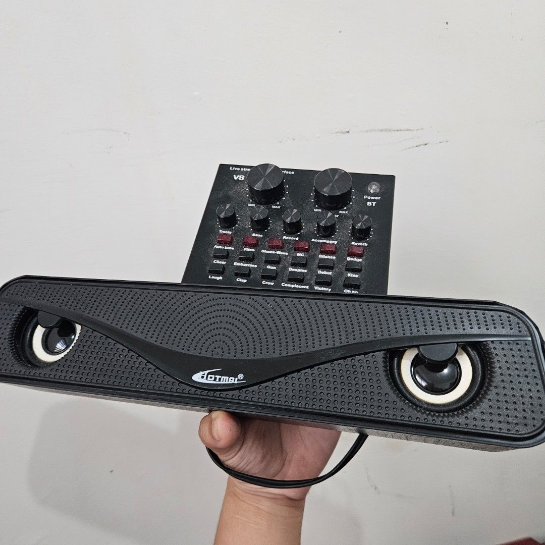 Speaker and Audio Interface (Category: Soundbars, Speakers & Amplifiers) located in Manila. Submitted by atarinayum07034 (Listing ID 1427839445, Image 1). Description: Speaker comes with a sound card, perfect for audio input and output. It features a sleek black design with a Dotmar logo. The speaker has two visible speaker drivers. The sound card has multiple knobs and buttons for audio adjustments..