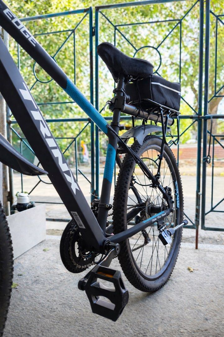 Trinx Edge Elite Hyd (Category: Bicycles) located in Las Pinas. Submitted by plusgarage.ph (Listing ID 1427913979, Image 2). Description: For sale: Trinx Edge Elite Hyd RFS: Switching to road bike Issues: Minor rusting on screws, and disk brakes Usage: almost 2 years Price: Php 10k (with 2k+ worth of accessories included) Slightly negotiable Included: - carrier bag - cycling chain protector pad - front and rear fenders - headlight with horn - hel