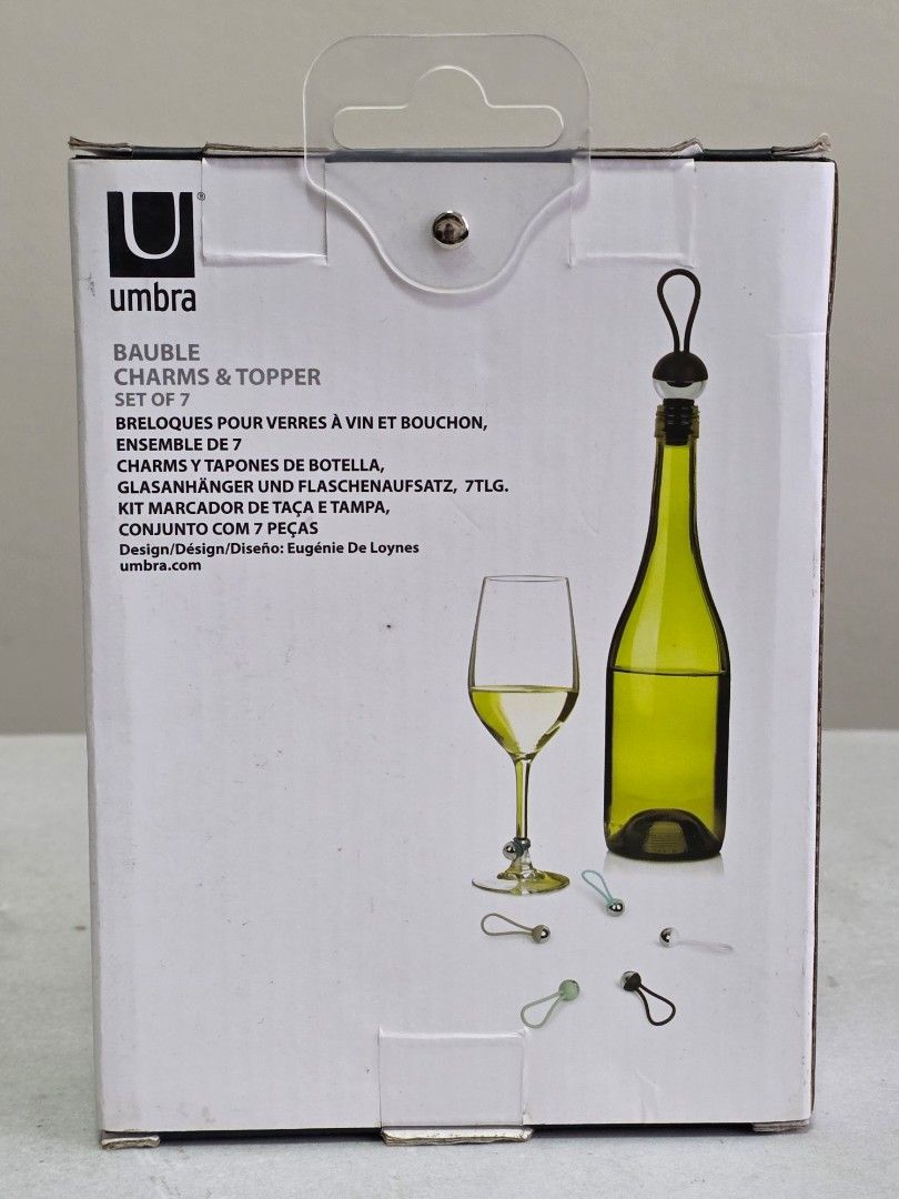 Umbra Bauble Wine Charms & Topper Set (Category: Water Bottles & Tumblers) located in Manila. Submitted by tch_86 (Listing ID 1427802570, Image 1). Description: Umbra Bauble set includes a wine bottle stopper and seven wine glass charms. The charms come in various colors. The box indicates the set is designed in England. It is a complete set with 7 pieces. Perfect for parties or as a gift..