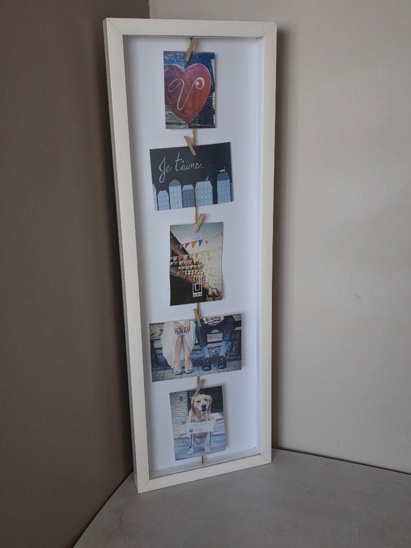 Umbra clothesline flip photo display (Category: Other Photography Accessories) located in Manila. Submitted by tch_86 (Listing ID 1427815434, Image 1). Description: Dimension: 28.5x9.5x1.5" The design is minimalist and will complement other frames. Enables you the refresh your refresh your memories as often as you like with its wooden clips..