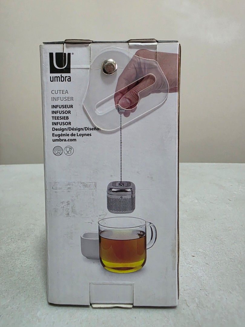 Umbra cutea infuser (Category: Coffee & Tea Tableware) located in Manila. Submitted by tch_86 (Listing ID 1427789420, Image 3). Description: For coffee or tea lovers out there or your gift idea! Dimension : 2.5"L x 2"W x 2.5"H Materual: Ceramic Pull the chain out, steep your tea and tuck the chain away when you're done Metal tea infuser with matte ceramic saucer Designed by Eugenie De Loynes.