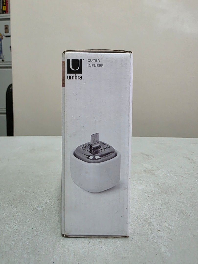 Umbra cutea infuser (Category: Coffee & Tea Tableware) located in Manila. Submitted by tch_86 (Listing ID 1427789420, Image 2). Description: For coffee or tea lovers out there or your gift idea! Dimension : 2.5"L x 2"W x 2.5"H Materual: Ceramic Pull the chain out, steep your tea and tuck the chain away when you're done Metal tea infuser with matte ceramic saucer Designed by Eugenie De Loynes.