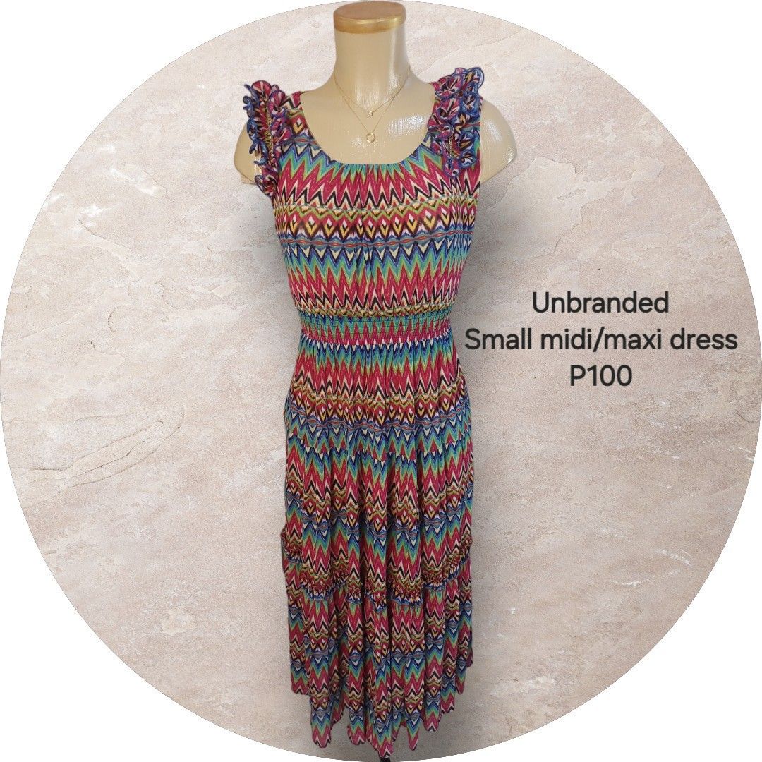 Unbranded Small Midi/Maxi Dress (Category: Dresses) located in Binan City. Submitted by cp_ph (Listing ID 1427824310, Image 1). Description: Unbranded midi/maxi dress features a colorful zigzag pattern. It has a fitted bodice with a smocked waist and a flowing skirt. The dress has ruffled cap sleeves. It is a vibrant and eye-catching piece, perfect for casual wear. The dress is priced at P100..