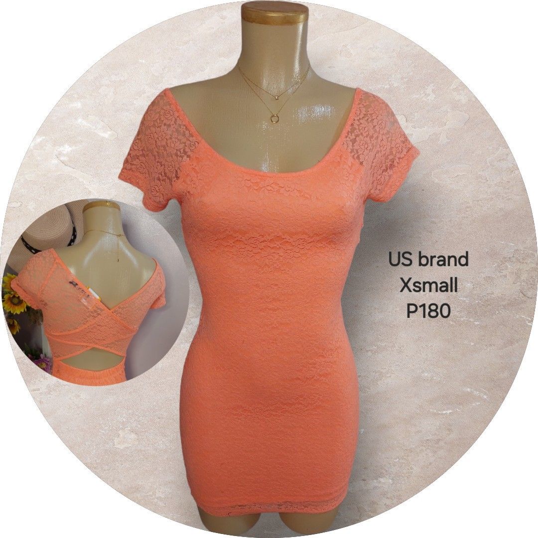 US Brand Lace Top - XSmall (Category: Others Tops) located in Binan City. Submitted by cp_ph (Listing ID 1427824130, Image 1). Description: Coral-colored lace top from a US brand. Features a scoop neckline and short sleeves. The back has a criss-cross design. Size XSmall. Perfect for a night out or a special occasion. The top is form-fitting and made of a lace material..