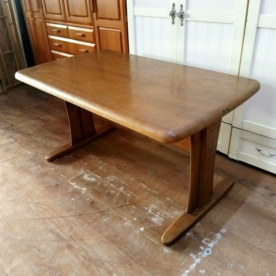 2nd hand ONISHI SANGYO Dining Table | Solid Wood (Category: Tables & Sets) located in Paranaque City. Submitted by feybelhaft (Listing ID 1428036133, Image 3). Description: Solid wooden table by Onishi Sangyo. Features a rectangular tabletop with rounded edges and sturdy, curved legs. Dimensions are L130cm x W80cm x H70cm. The table has a natural wood finish. Perfect for dining or as a workspace. A classic piece that adds warmth to any room..