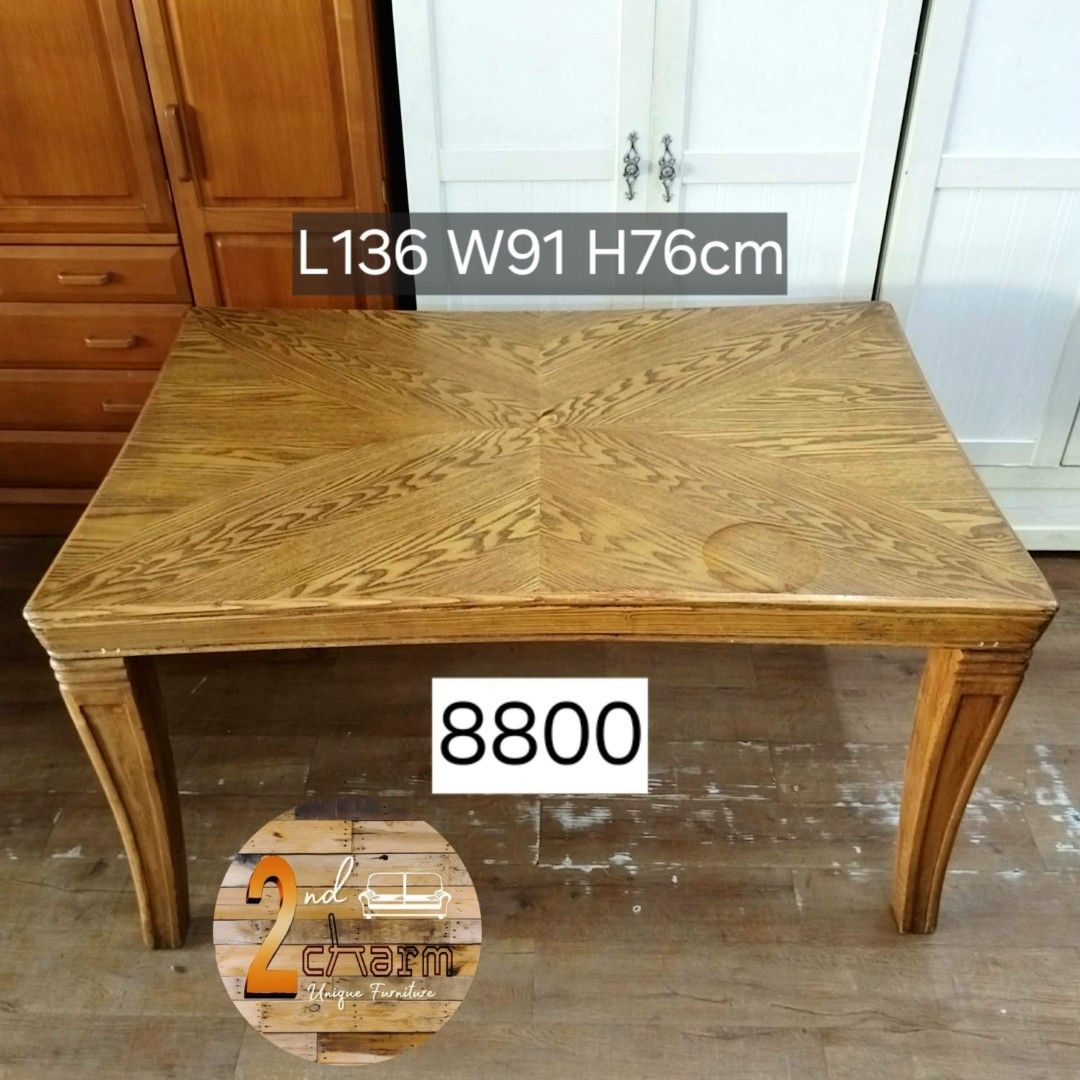 2nd hand Solid Wood Herringbone Pattern Dining Table - 136x91x76cm (Category: Tables & Sets) located in Paranaque City. Submitted by feybelhaft (Listing ID 1428030462, Image 2). Description: Elegant wooden dining table. Features a rectangular tabletop with a unique wood grain pattern. The table has sturdy, curved legs. Dimensions are L136cm, W91cm, and H76cm. Perfect for a dining room or kitchen. The table has a warm, natural wood color..