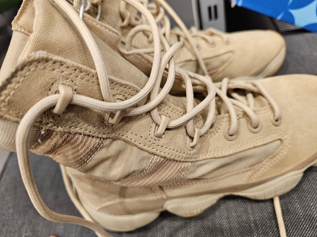 Adidas Yeezy 500 Tactical Boots (Category: Boots) located in Taguig. Submitted by suque_shop (Listing ID 1428084373, Image 1). Description: These Adidas Yeezy NSLTD Boots feature a tan colorway. They have a unique design with a padded upper and a chunky sole. The boots have a lace-up closure and a high-top design. The soles show a distinctive pattern for grip. They appear to be well-maintained and ready for wear..