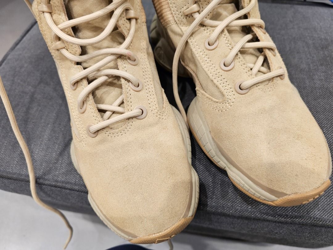 Adidas Yeezy 500 Tactical Boots (Category: Boots) located in Taguig. Submitted by suque_shop (Listing ID 1428084373, Image 2). Description: These Adidas Yeezy NSLTD Boots feature a tan colorway. They have a unique design with a padded upper and a chunky sole. The boots have a lace-up closure and a high-top design. The soles show a distinctive pattern for grip. They appear to be well-maintained and ready for wear..
