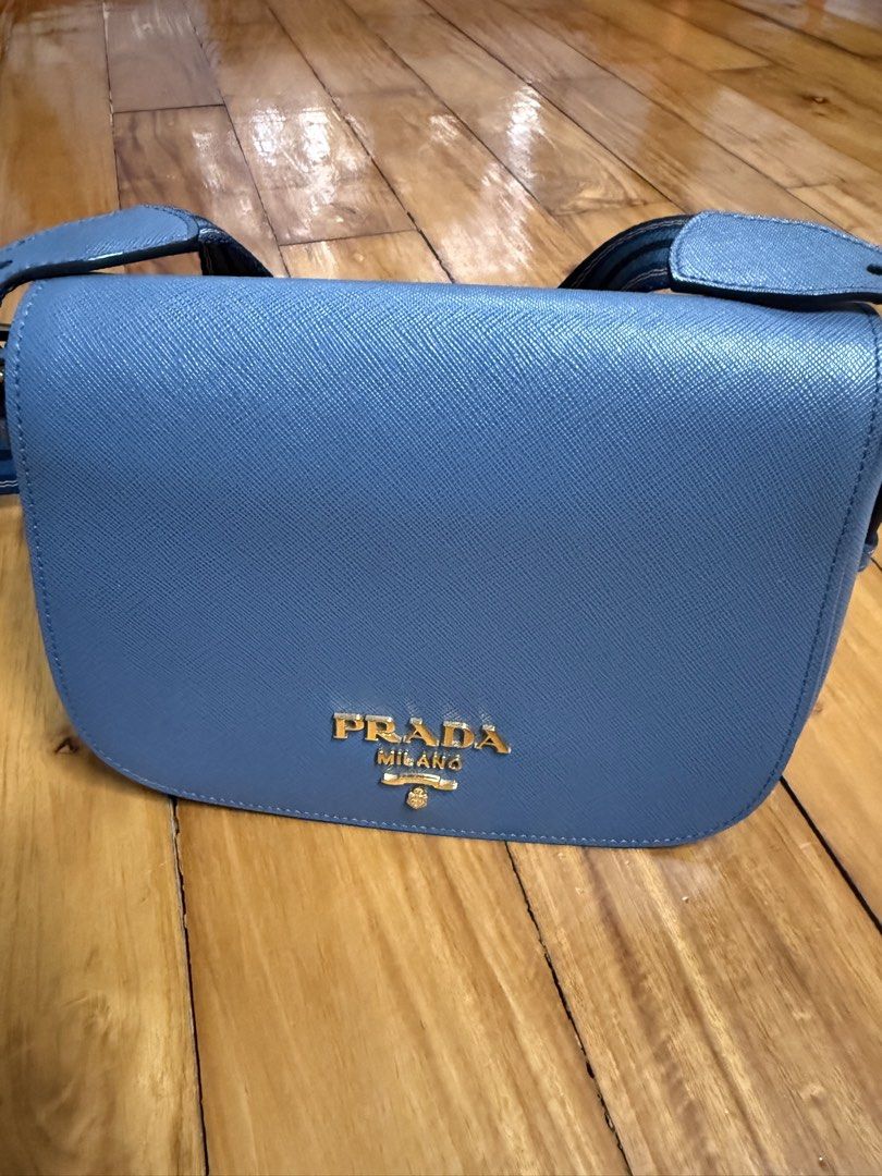 Authentic PRADA SAFFIANO FLAP CAMERA BAG (Category: Luxury Bags & Wallets) located in Manila. Submitted by a.c.shop (Listing ID 1428022769, Image 1). Description: Color : Marine Authentic with authenticity card Bought from Europe Pls see posted flaws.