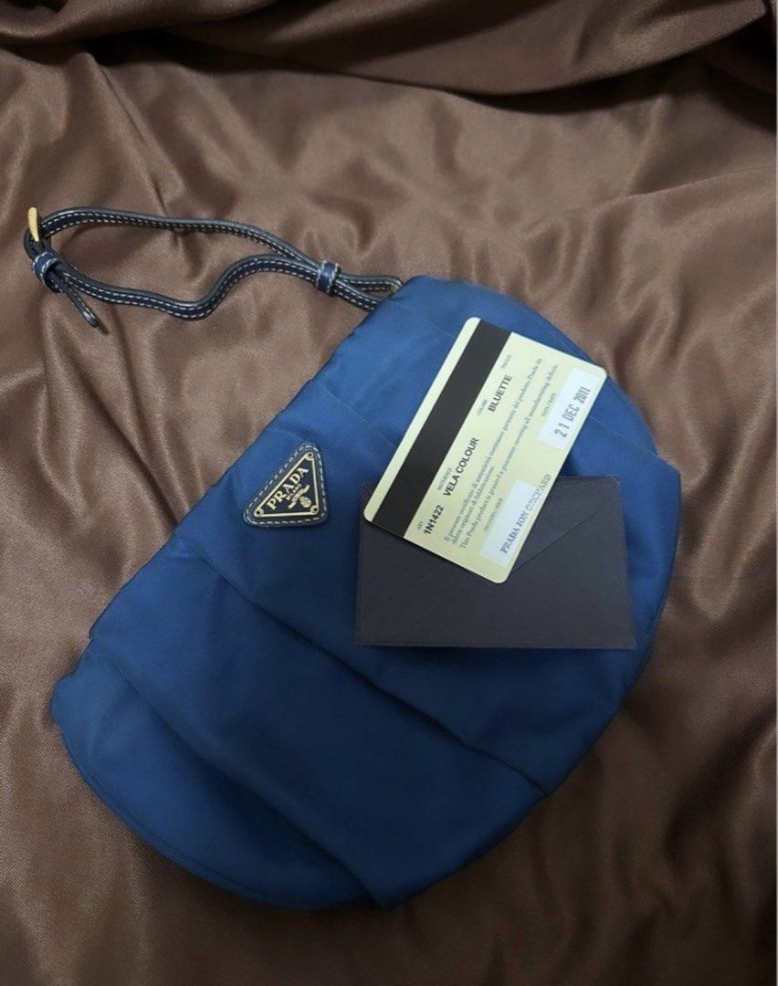 Authentic PRADA Wristlet (Category: Luxury Bags & Wallets) located in Cavite. Submitted by trendydotnet (Listing ID 1428023643, Image 1). Description: READ BELOW! SWIPE➡️ PHOTO DETAILS 🔍ITEM GUARANTEED 💯% AUTHENTIC Authentic PRADA Nylon Wristlet/Pouch - with Authenticity Card - Gold Hardware still okay not faded - Signs of wear as commonly seen in preloved items - Bought in Singapore - Not for fussy buyer - C0lor may vary due to lighting - Mana