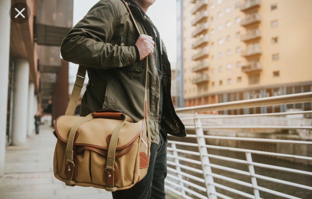 Billingham vintage 225 Camera Bag (Category: Luxury Bags & Wallets) located in Santa Rosa. Submitted by _ba_mo_si_ (Listing ID 1428051292, Image 2). Description: Durable Billingham camera bag, made in England. Features a tan canvas exterior with leather accents and a comfortable shoulder strap. Includes multiple compartments and a padded interior for camera gear protection. The bag has a top handle for easy carrying. Zippers and clasps are visibl