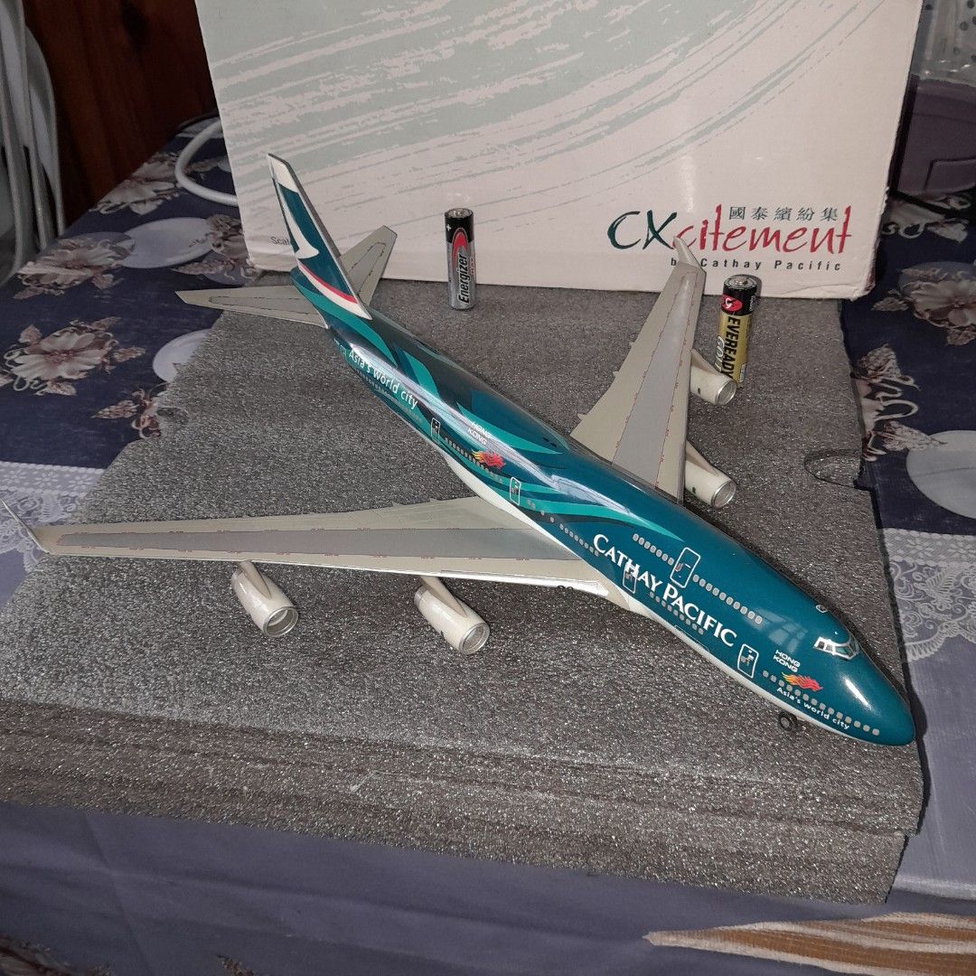 Cathay Pacific Boeing 747-400 (Category: Vehicle & Diecast Models) located in Baguio. Submitted by shellcollector (Listing ID 1427986419, Image 3). Description: Cathay Pacific Boeing 747-400 1:200 scale diecast model Features the "Asia's World City" livery Not diecast With stand but with broken peg Box in good condition 3800 Pesos Baguio shipping .