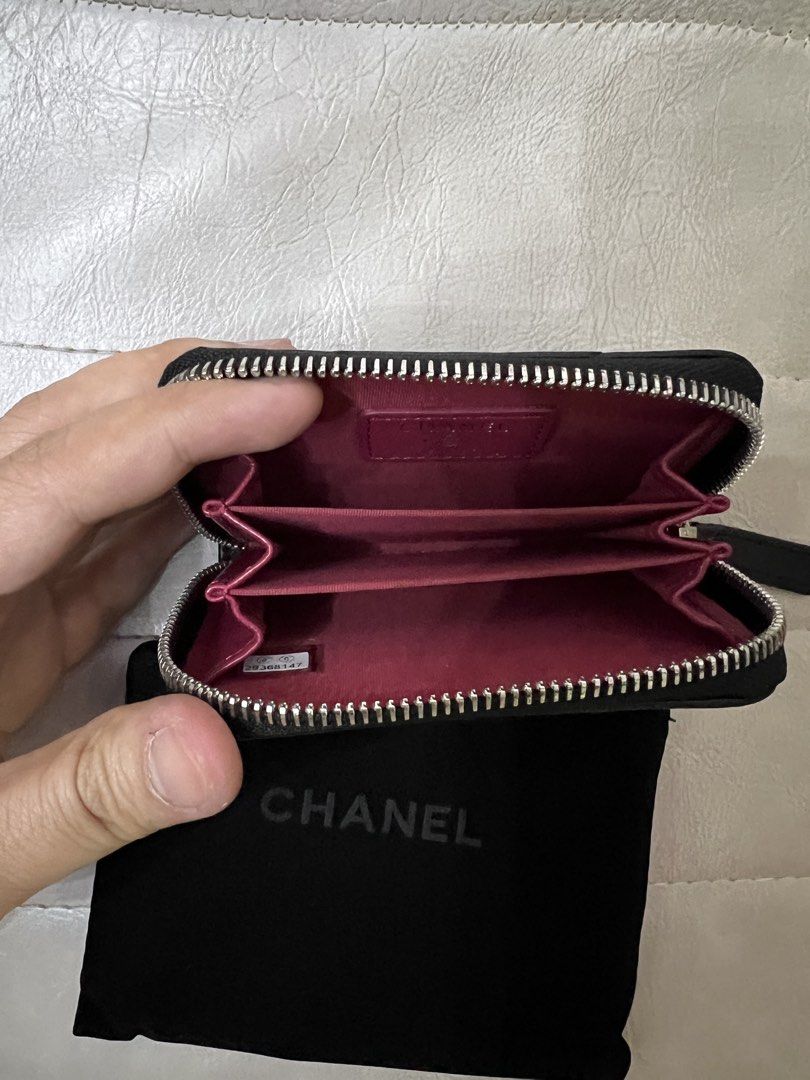 Chanel 19 Zip Coin Purse (Category: Luxury Bags & Wallets) located in Mandaluyong City. Submitted by ilovenicethings888 (Listing ID 1428045111, Image 3). Description: Black Chanel 19 zip coin purse. Features a quilted design with the iconic interlocking CC logo. The interior is lined with a pink fabric and includes multiple compartments. Comes with a Chanel dust bag and box..