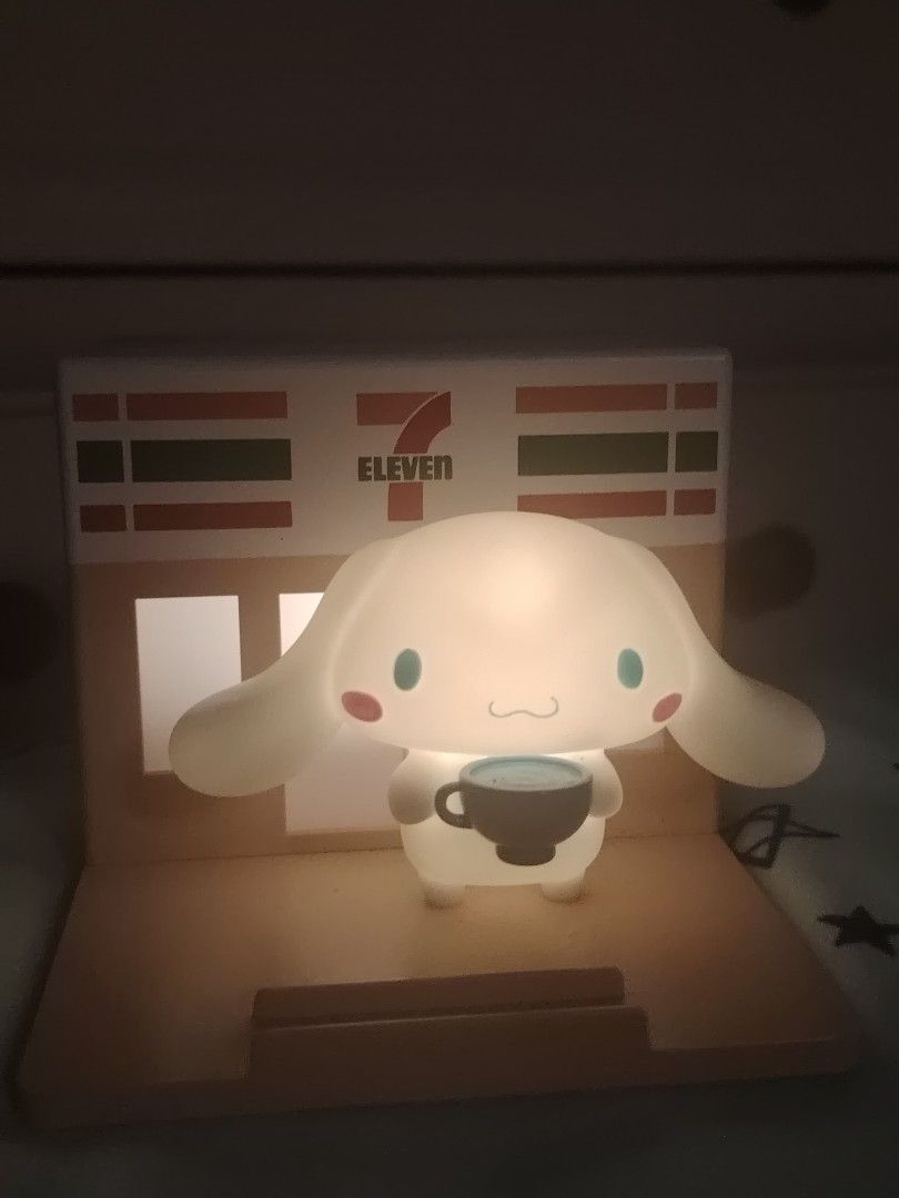 CINNAMOROLL 7 ELEVEN PHONE STAND WITH NIGHT LIGHT (Category: Character Goods) located in Rizal. Submitted by leicajnava05355 (Listing ID 1428093379, Image 1). Description: CINNAMOROLL 711 PHONE STAND WITH NIGHT LIGHT / WITH BATTERY INCLUDED Already (limited edition) .