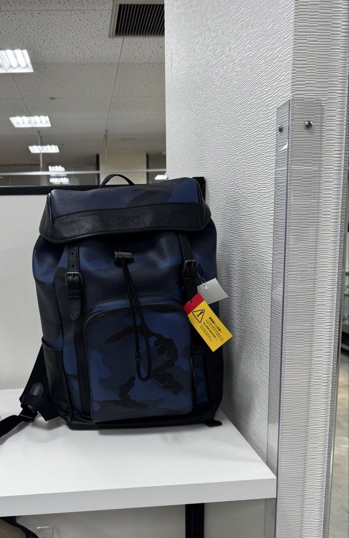 Coach Henry backpack in pebble leather features a blue and black camouflage pattern (Category: Backpacks) located in Makati City. Submitted by raindrops182 (Listing ID 1428058889, Image 1). Description: 2nd hand Coach Henry backpack in pebble leather features a blue and black camouflage pattern. Japan pasabuy. ETA 28march26.