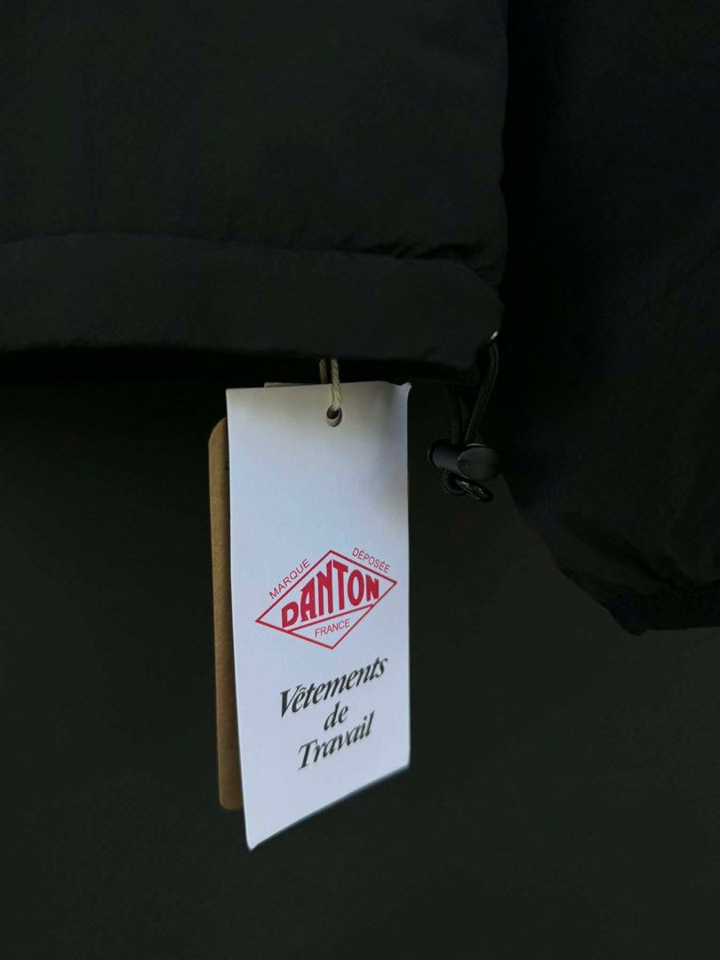 Danton Black Jacket (Category: Coats, Jackets and Outerwear) located in Manila. Submitted by archivedrip (Listing ID 1428065677, Image 3). Description: Black Danton jacket. Features a round collar, button closure, and two front pockets with zippers. The jacket has the Danton logo on the chest and inside the collar. The tag indicates the jacket is made of nylon and polyester. It also provides washing instructions..