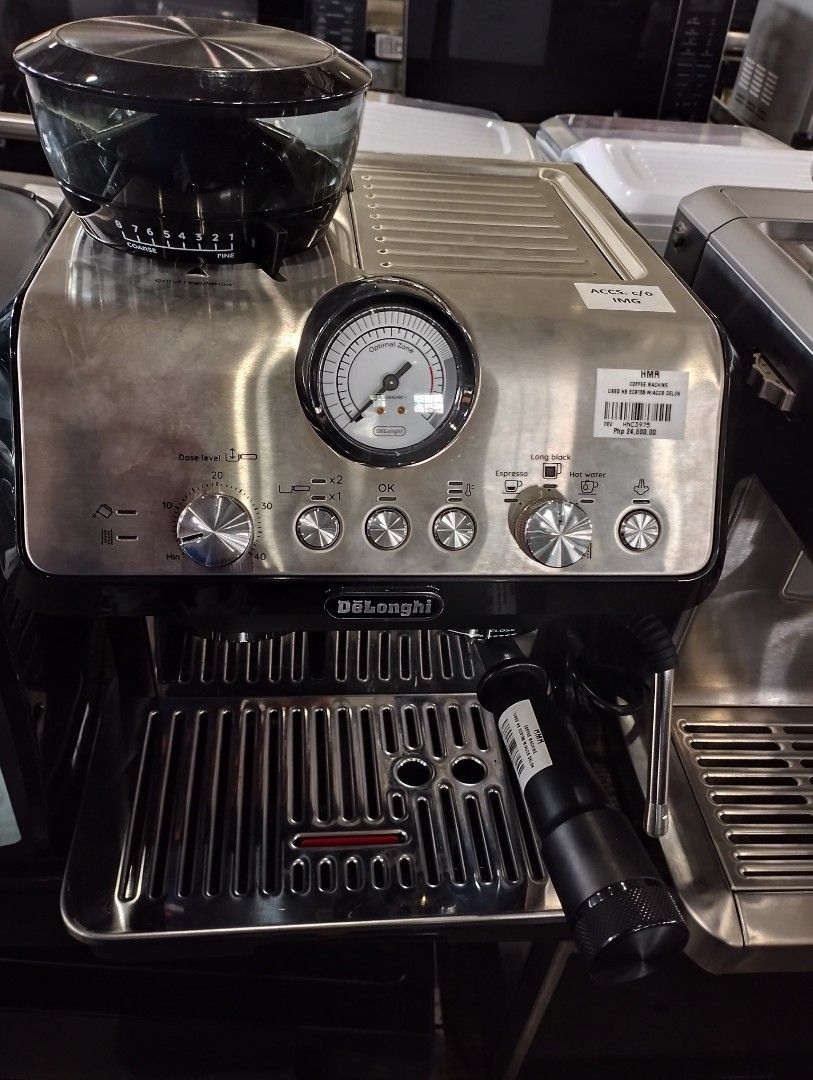 DeLonghi EC9155 Coffee Machine (Category: Coffee Machines & Makers) located in Caloocan City. Submitted by dhiony (Listing ID 1427947814, Image 1). Description: DeLonghi EC9155 coffee machine with built-in grinder. Features a pressure gauge and various control knobs. The machine has a stainless steel finish and a black base. .