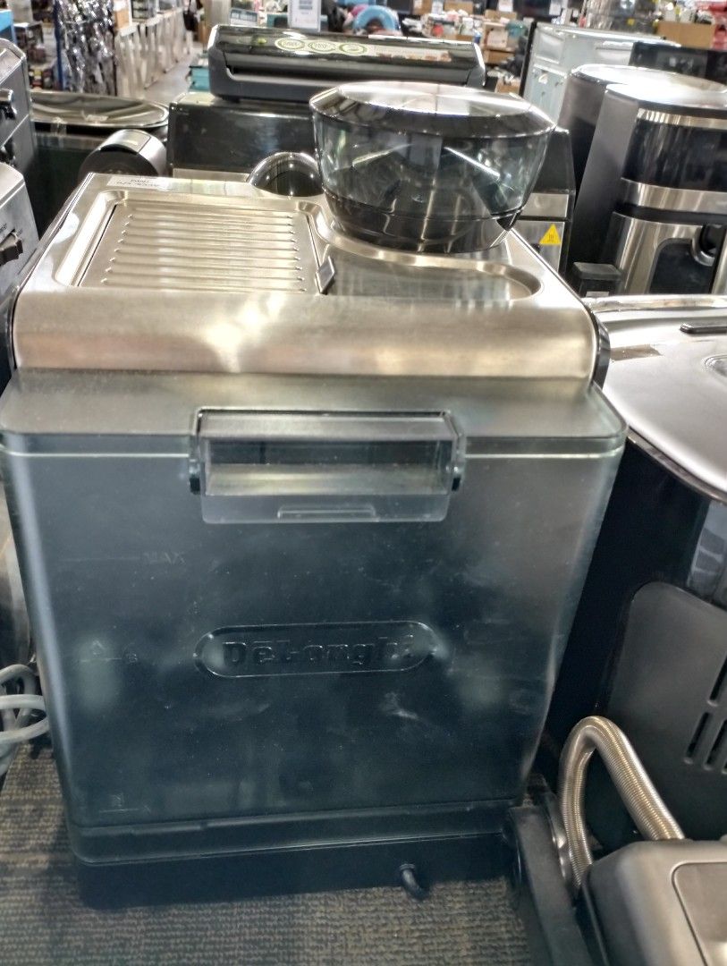 DeLonghi EC9155 Coffee Machine (Category: Coffee Machines & Makers) located in Caloocan City. Submitted by dhiony (Listing ID 1427947814, Image 2). Description: DeLonghi EC9155 coffee machine with built-in grinder. Features a pressure gauge and various control knobs. The machine has a stainless steel finish and a black base. .