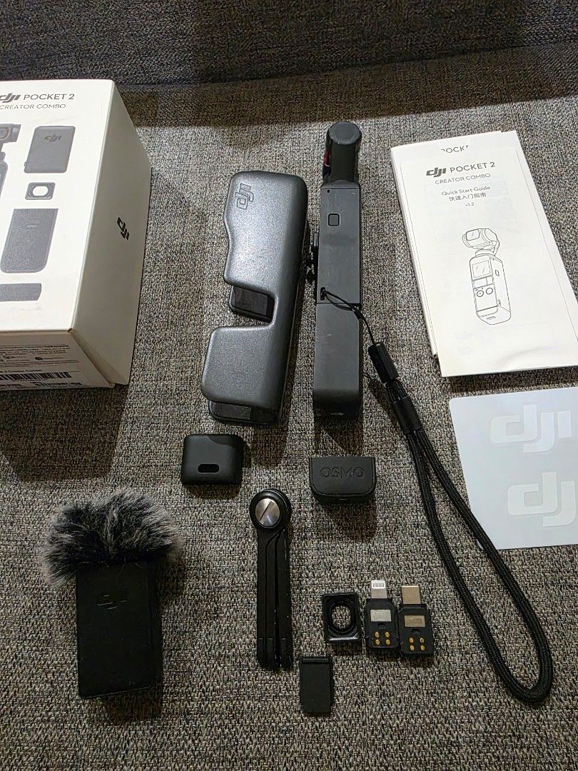 DJI Pocket 2 Creator Combo (Category: Cameras) located in Davao. Submitted by davaoactivewear (Listing ID 1427980996, Image 2). Description: DJI Pocket 2 Creator Combo. Includes the camera, case, microphone, tripod, and various adapters. Comes with the original box and manuals. Ready to capture high-quality videos and photos. Perfect for content creators and vloggers. Compact and easy to carry around..