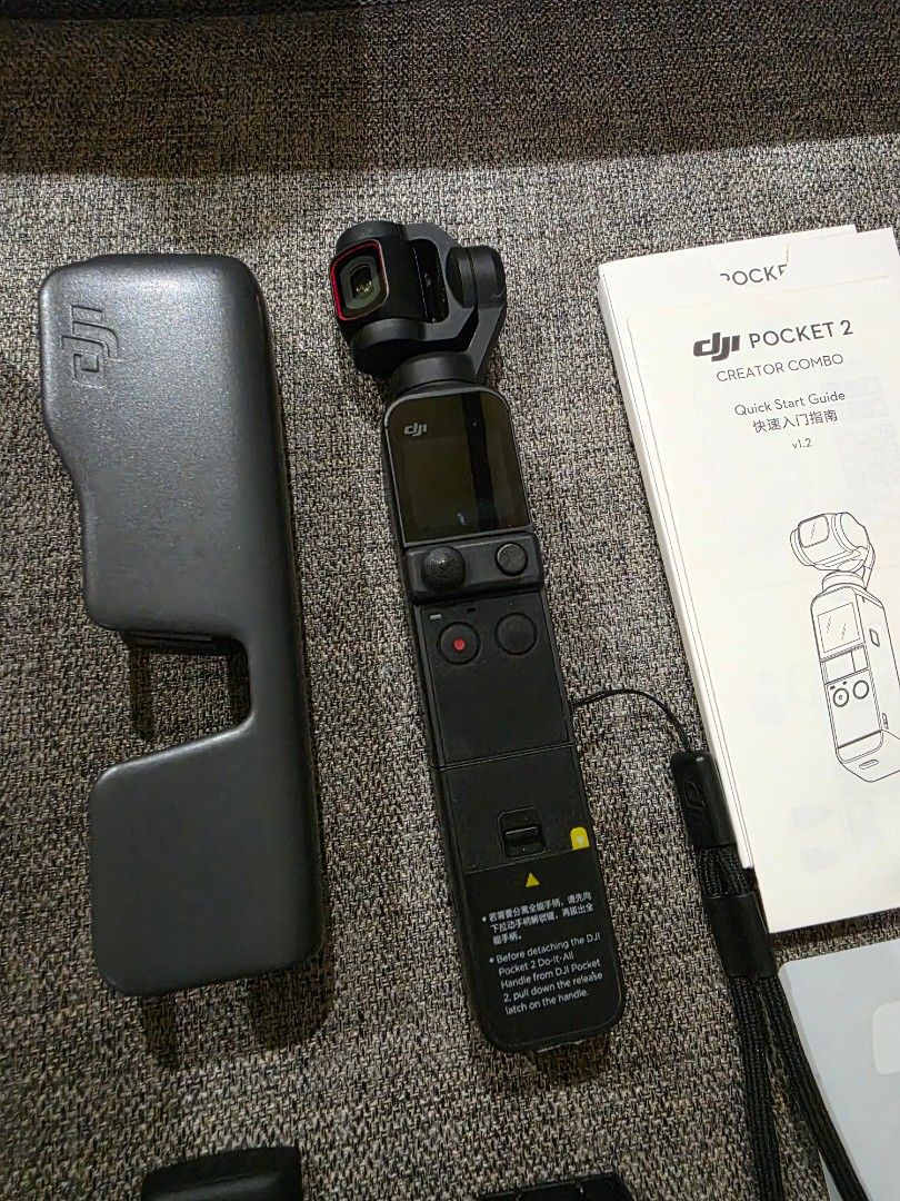 DJI Pocket 2 Creator Combo (Category: Cameras) located in Davao. Submitted by davaoactivewear (Listing ID 1427980996, Image 3). Description: DJI Pocket 2 Creator Combo. Includes the camera, case, microphone, tripod, and various adapters. Comes with the original box and manuals. Ready to capture high-quality videos and photos. Perfect for content creators and vloggers. Compact and easy to carry around..