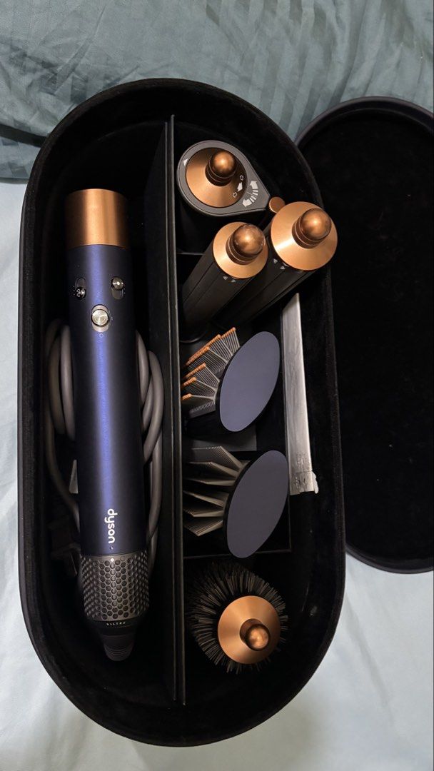 Dyson Airwrap Complete Long - Prussian Blue/Rich Copper (Category: Hair) located in Makati City. Submitted by neekkkeee_ (Listing ID 1428044712, Image 2). Description: Dyson Airwrap Complete Long - Prussian Blue/Rich Copper Original Price: 34,900 Complete attachments Original receipt inside. Bought Sept 2024. VERY lightly used. I only used the 30mm long barrel. Selling because I got a Korean perm so I wasn’t using it anymore. 😅💇🏻‍♀️.