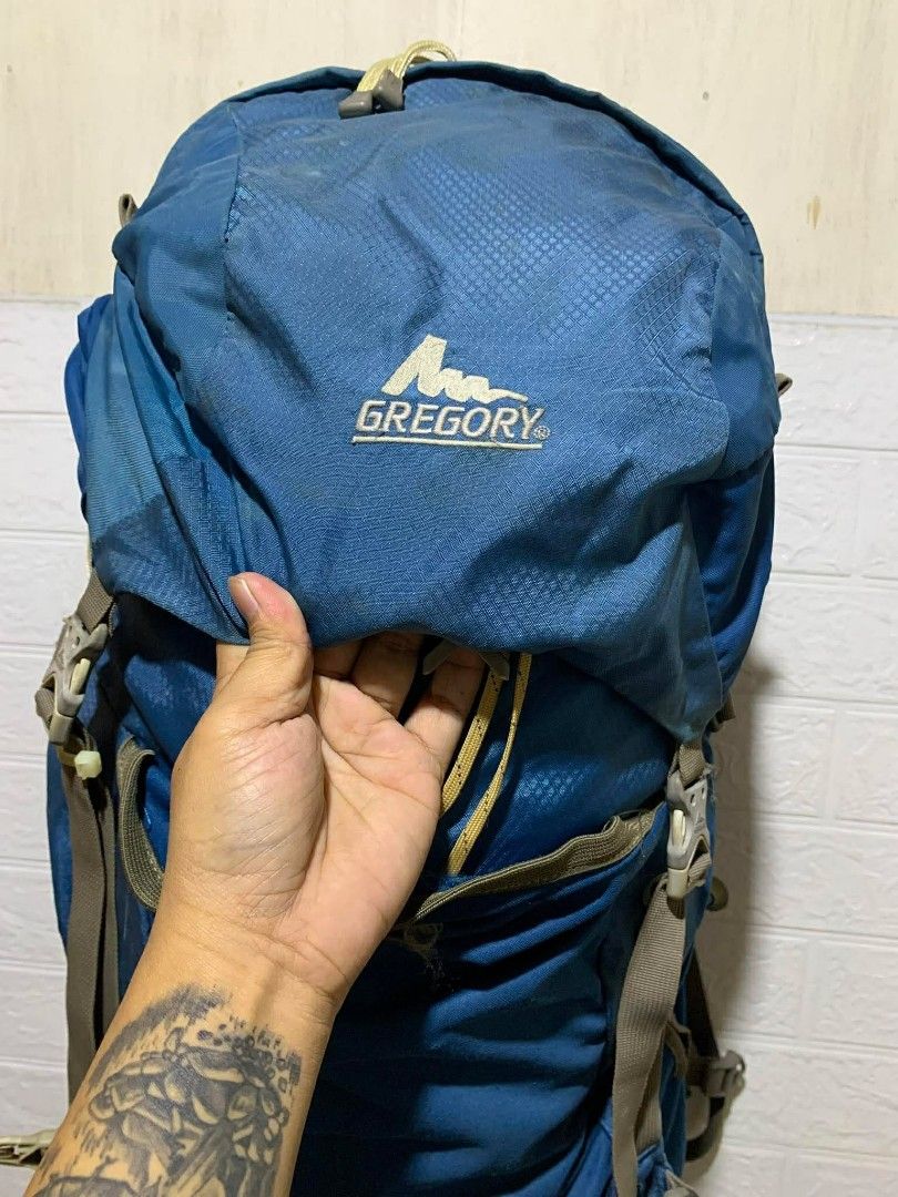 Gregory Z45 Backpack (Category: Backpacks) located in Santo Tomas. Submitted by jadelyoidd53654 (Listing ID 1427937570, Image 2). Description: Blue Gregory Z45 backpack. Features a Jetstream suspension system and multiple straps and compartments. The backpack has a 45L capacity. Includes a top flap with the Gregory logo. The backpack has multiple straps and buckles for secure closure and adjustment. The back panel is designed for comfort and vent