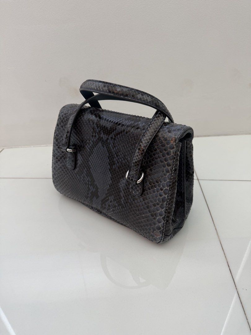 Gucci Python Leather Handbag (Category: Bags & Wallets) located in Singapore. Submitted by billettan (Listing ID 1428009700, Image 2). Description: - Beautiful python leather handbag - Top handle design - Secure clasp closure - Multiple interior compartments - Minimal signs of wear - Stylish and unique accessory - Dust bag n box in new condition. .
