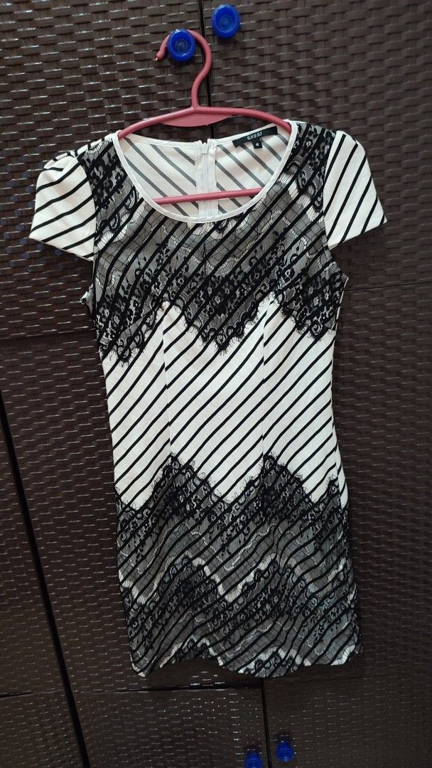 Gucci Striped Dress with Lace (Category: Dresses) located in Manila. Submitted by anez06 (Listing ID 1428048396, Image 1). Description: Elegant dress featuring a black and white striped pattern with lace detailing. It has short sleeves and a zipper at the back. The dress is labeled with the Gucci brand and size S. Made in Italy..